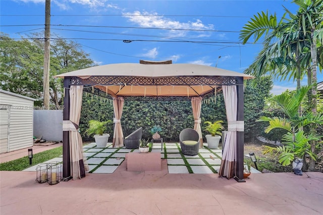 view of patio / terrace featuring a gazebo and fence