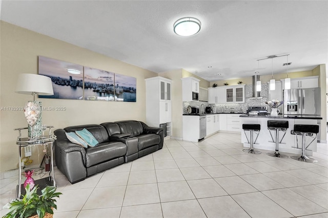 living area with light tile patterned flooring