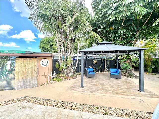 view of patio featuring a gazebo and fence