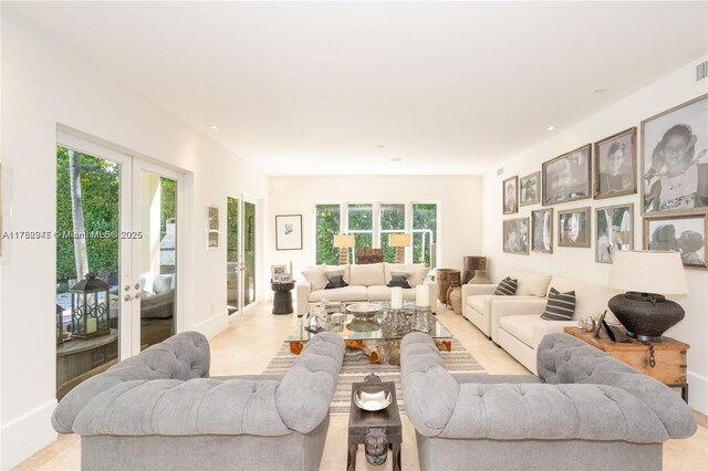 31 Island Dr, Key Biscayne, FL 33149 - living room with french doors, recessed lighting, and baseboards
