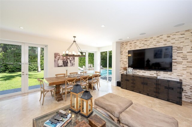 31 Island Dr, Key Biscayne, FL 33149 - dining room with french doors, plenty of natural light, a chandelier, and recessed lighting