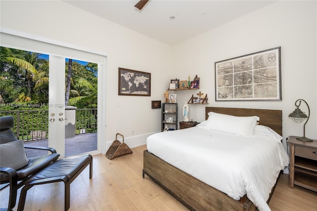 31 Island Dr, Key Biscayne, FL 33149 - bedroom featuring access to exterior, light wood-type flooring, and baseboards