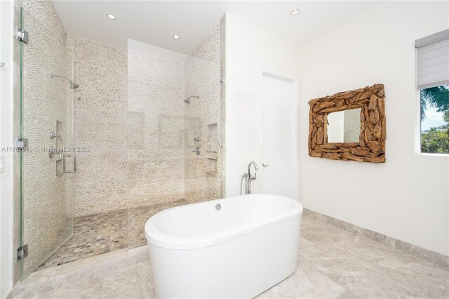 31 Island Dr, Key Biscayne, FL 33149 - bathroom featuring a stall shower, a freestanding bath, and recessed lighting