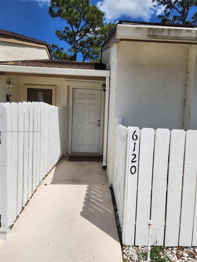 6120 Newstead Ct, Green Acres, FL 33463 - view of exterior entry featuring fence and radiator