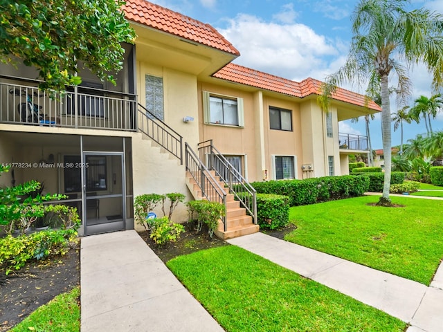 view of property featuring stairs