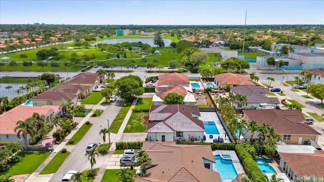 bird's eye view with a water view and a residential view