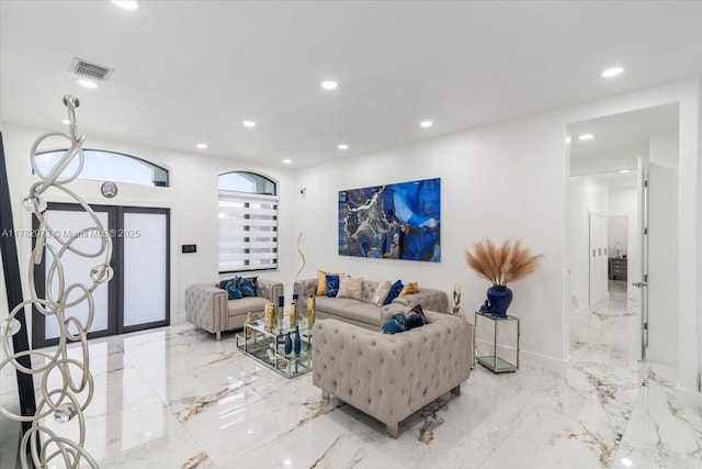 living area with marble finish floor, baseboards, visible vents, and recessed lighting