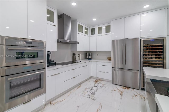 kitchen featuring stainless steel appliances, marble finish floor, modern cabinets, and wall chimney range hood