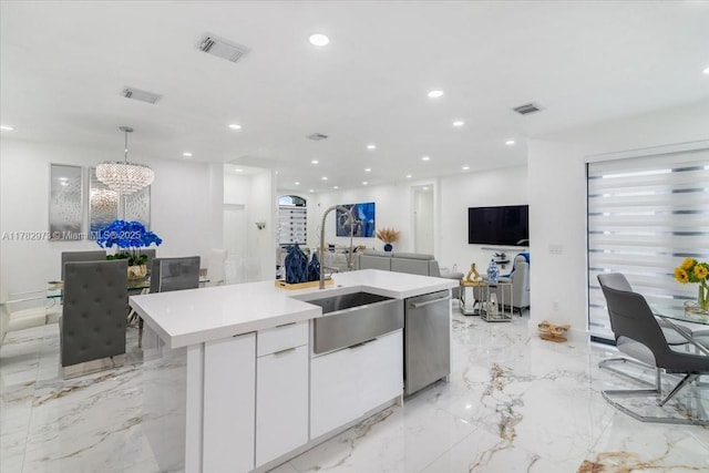 kitchen with visible vents, white cabinets, marble finish floor, and light countertops