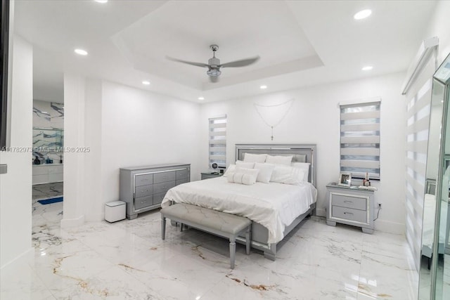 bedroom featuring baseboards, a raised ceiling, a ceiling fan, recessed lighting, and marble finish floor