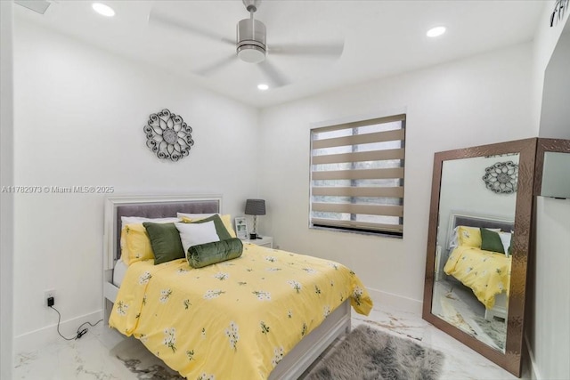 bedroom featuring marble finish floor, baseboards, and recessed lighting