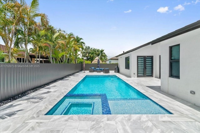 view of pool with a patio area, a fenced backyard, an outdoor living space, and a pool with connected hot tub