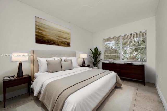 9050 NW 28th St Unit 114, Coral Springs, FL 33065 - bedroom with light tile patterned floors and baseboards