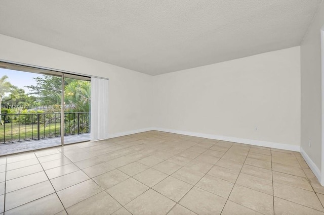 9050 NW 28th St Unit 114, Coral Springs, FL 33065 - unfurnished room with light tile patterned floors and a textured ceiling