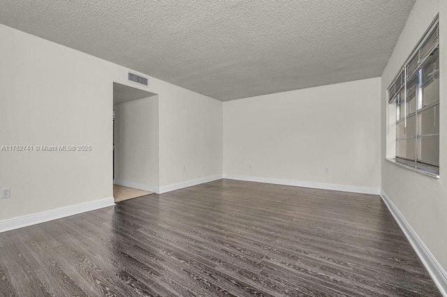 9050 NW 28th St Unit 114, Coral Springs, FL 33065 - empty room featuring wood finished floors and a textured ceiling
