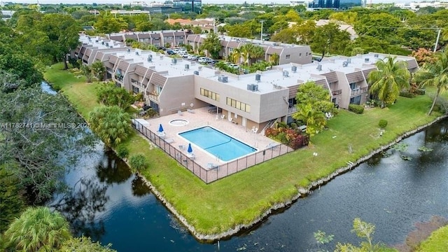 9050 NW 28th St Unit 114, Coral Springs, FL 33065 - drone / aerial view of a pool area and a nearby body of water