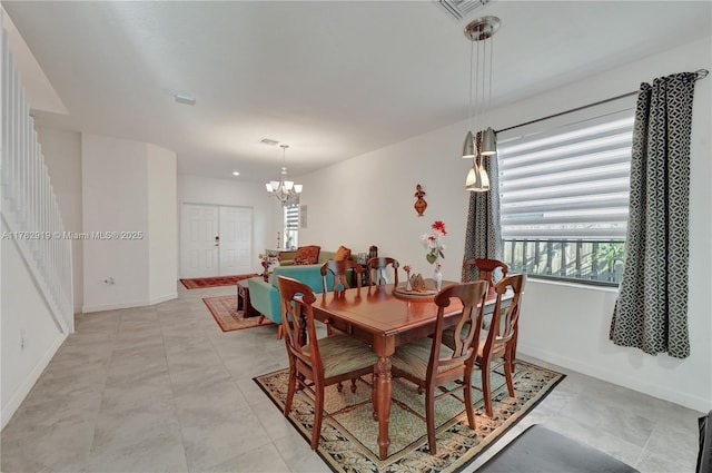 20900 NE 2nd Ct, Miami, FL 33179 - dining area with visible vents, baseboards, and an inviting chandelier
