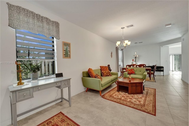 20900 NE 2nd Ct, Miami, FL 33179 - living area with light tile patterned floors, an inviting chandelier, visible vents, and a wealth of natural light