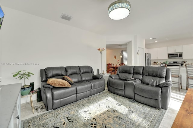 20900 NE 2nd Ct, Miami, FL 33179 - living area with light tile patterned floors and visible vents
