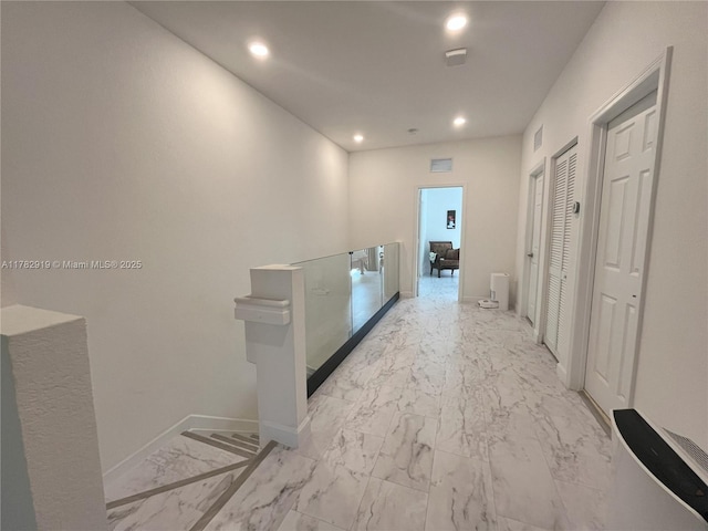20900 NE 2nd Ct, Miami, FL 33179 - corridor featuring marble finish floor, baseboards, visible vents, and recessed lighting