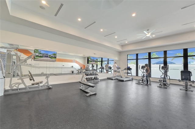 20900 NE 2nd Ct, Miami, FL 33179 - gym featuring a raised ceiling, ceiling fan, baseboards, and recessed lighting