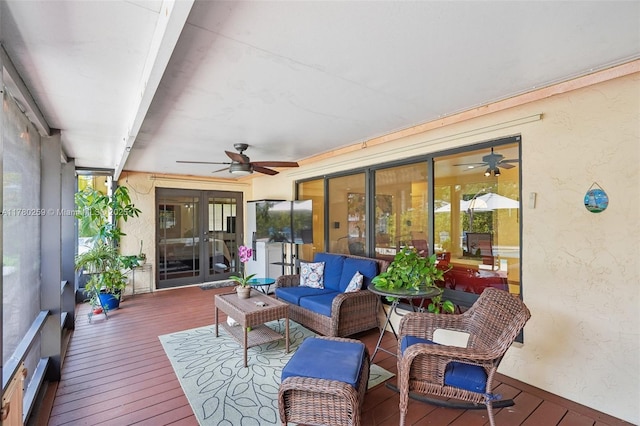 sunroom featuring an outdoor living space and ceiling fan