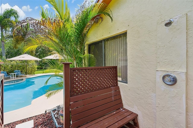 view of swimming pool with a fenced in pool