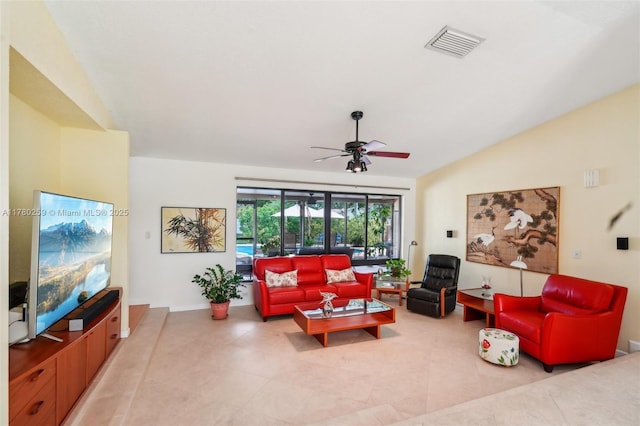 living room featuring visible vents, ceiling fan, light tile patterned floors, and lofted ceiling