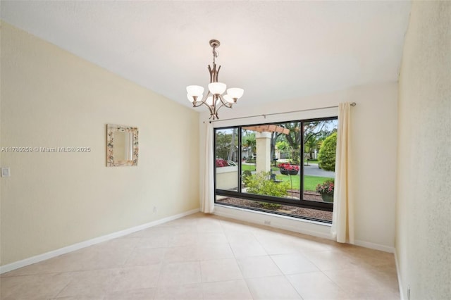 empty room with baseboards, an inviting chandelier, and light tile patterned flooring