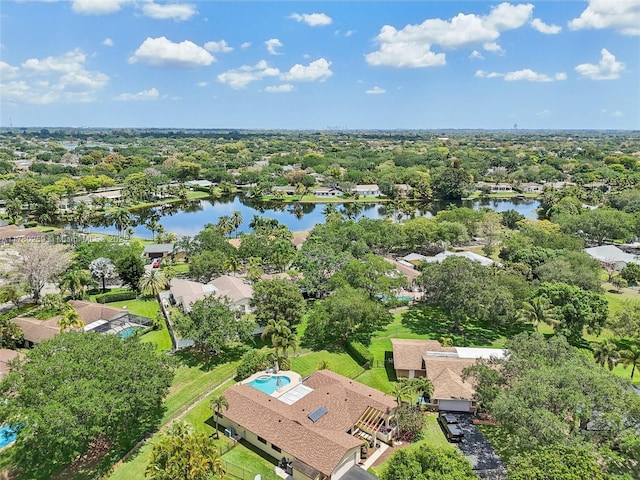 birds eye view of property with a water view and a residential view