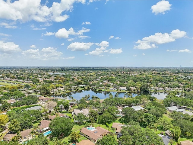 drone / aerial view with a water view and a residential view