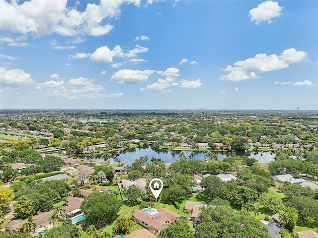drone / aerial view featuring a water view and a residential view