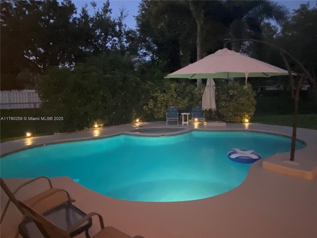 view of swimming pool with a fenced in pool