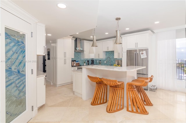 100 S Birch Rd Unit 1602C, Fort Lauderdale, FL 33316 - kitchen with freestanding refrigerator, wall chimney range hood, light countertops, white cabinetry, and recessed lighting