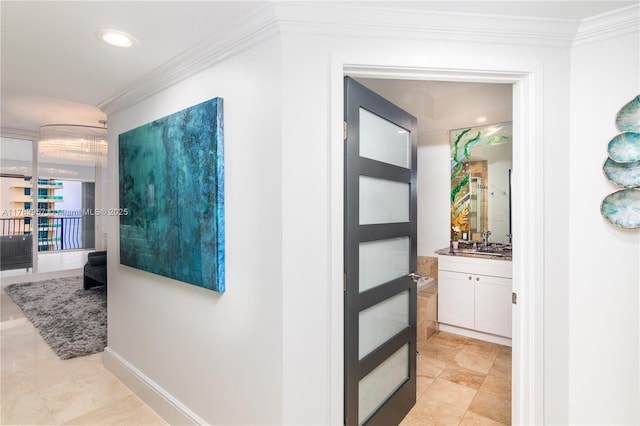 100 S Birch Rd Unit 1602C, Fort Lauderdale, FL 33316 - hallway with crown molding, a sink, light tile patterned floors, and recessed lighting