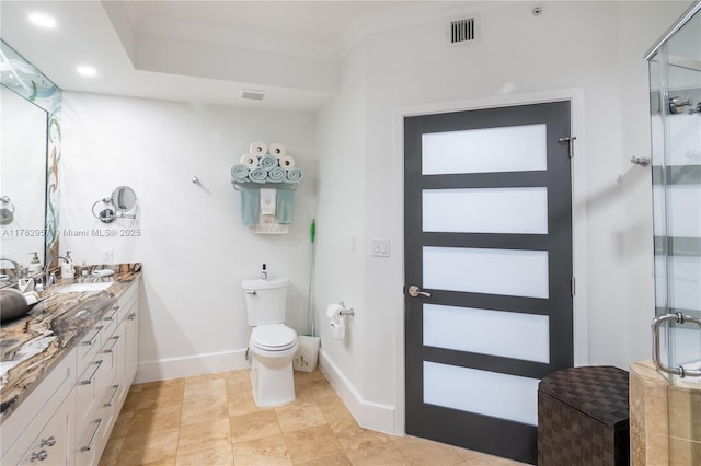 100 S Birch Rd Unit 1602C, Fort Lauderdale, FL 33316 - bathroom with double vanity, a shower stall, crown molding, baseboards, and toilet