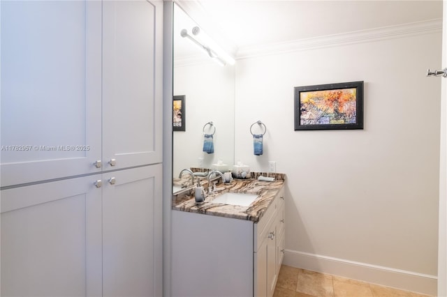 100 S Birch Rd Unit 1602C, Fort Lauderdale, FL 33316 - bathroom featuring ornamental molding, vanity, baseboards, and tile patterned floors