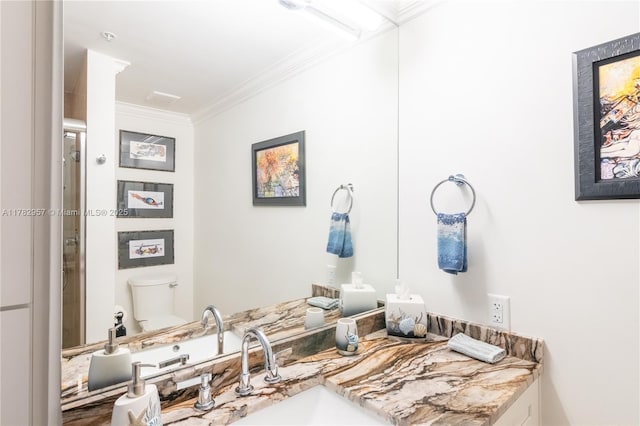 100 S Birch Rd Unit 1602C, Fort Lauderdale, FL 33316 - bathroom with ornamental molding, toilet, and vanity