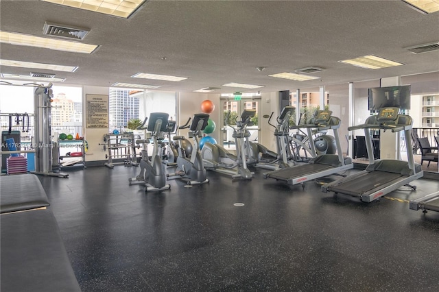 100 S Birch Rd Unit 1602C, Fort Lauderdale, FL 33316 - workout area with plenty of natural light and a textured ceiling