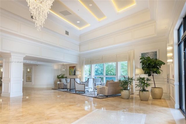 100 S Birch Rd Unit 1602C, Fort Lauderdale, FL 33316 - community lobby featuring a decorative wall, a towering ceiling, and ornamental molding