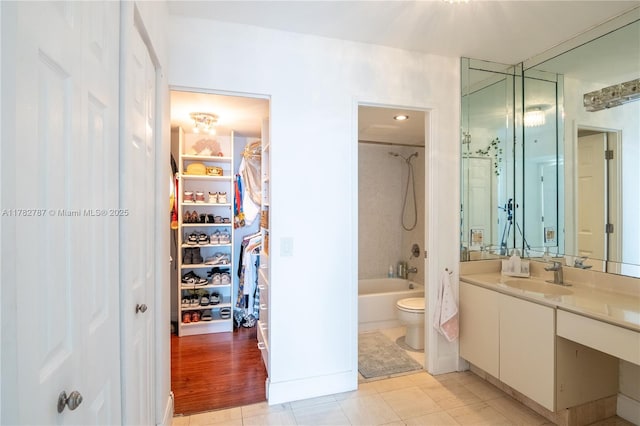 3731 N Country Club Dr Unit 1927, Aventura, FL 33180 - full bathroom featuring a spacious closet, vanity, toilet, and shower / washtub combination