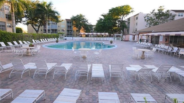 community pool with a patio