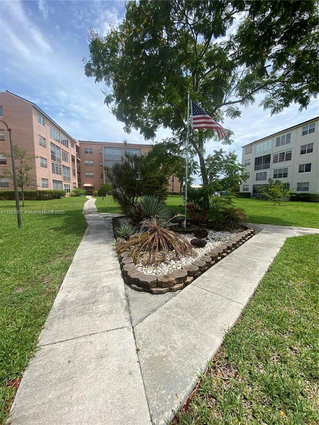 view of community featuring a lawn