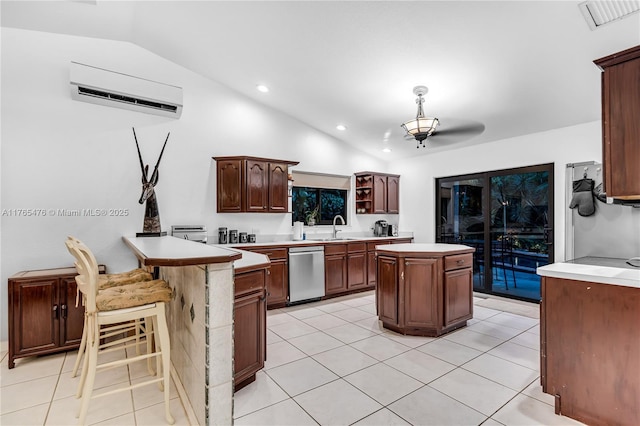 9 Bass Ave, Key Largo, FL 33037 - kitchen featuring stainless steel dishwasher, lofted ceiling, light countertops, a wall mounted AC, and recessed lighting