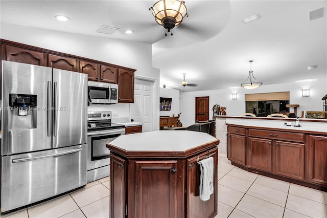 9 Bass Ave, Key Largo, FL 33037 - kitchen featuring appliances with stainless steel finishes, a ceiling fan, light tile patterned flooring, light countertops, and recessed lighting