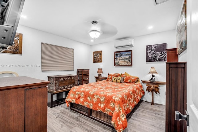 9 Bass Ave, Key Largo, FL 33037 - bedroom with a wall mounted air conditioner, light wood-type flooring, and recessed lighting