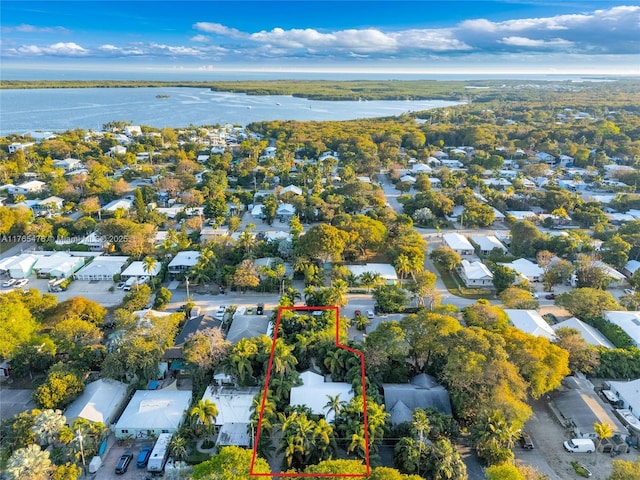 9 Bass Ave, Key Largo, FL 33037 - aerial perspective of suburban area with property boundaries highlighted and a nearby body of water