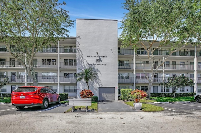 view of property with uncovered parking