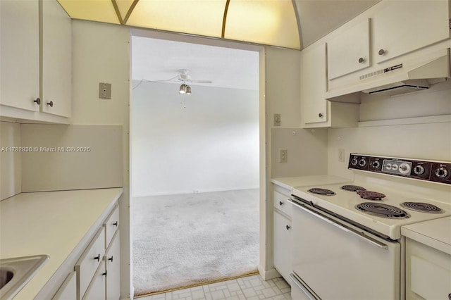 kitchen featuring light carpet, light countertops, under cabinet range hood, ceiling fan, and white range with electric cooktop