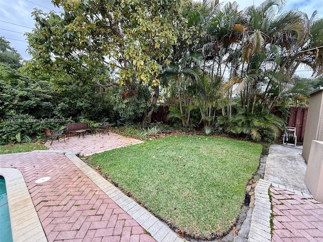 view of yard featuring a patio area and fence